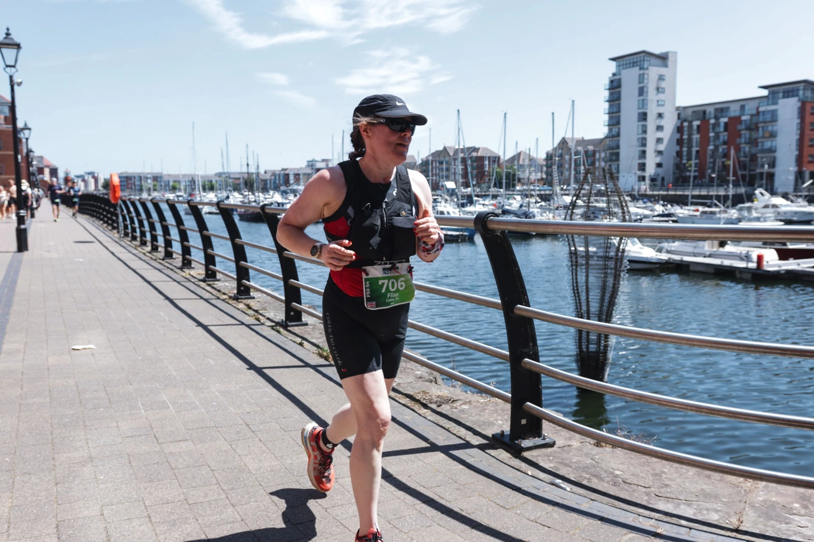 Fliss running at IRONMAN 70.3 Swansea after her weight-loss progress