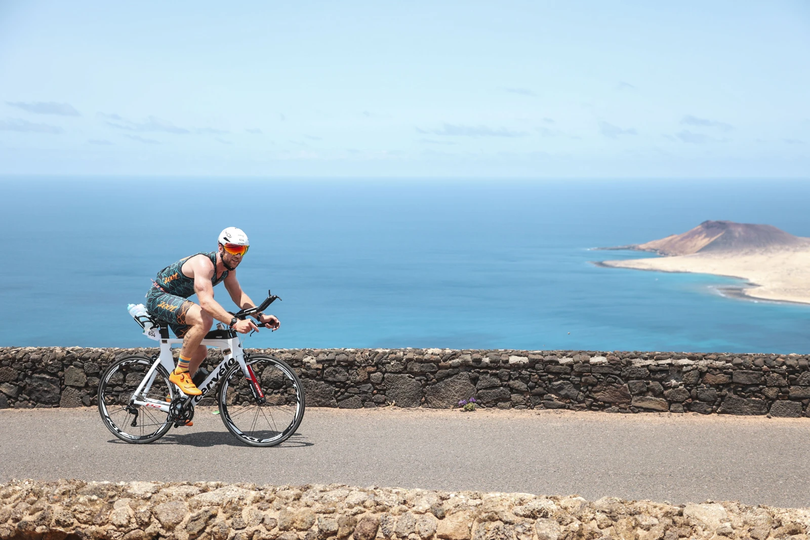 Joe cycling beside the coast at IRONMAN Lanzarote