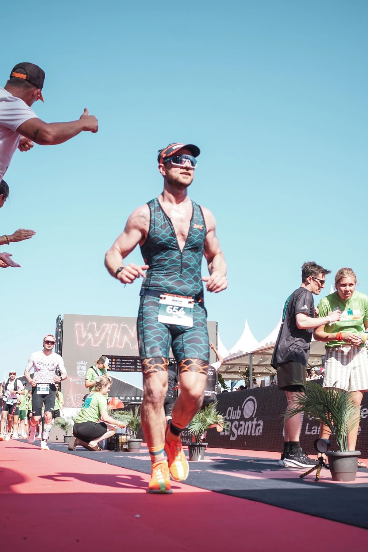 Joe running on the IRONMAN Lanzarote finish carpet